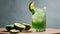 Green drink with lemon and lime wedges