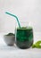 Green drink prepared with single celled green algae chlorella. Detox superfood in the glass