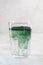 Green drink prepared with single celled green algae chlorella. Detox superfood in the glass