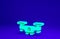 Green Drone flying icon isolated on blue background. Quadrocopter with video and photo camera symbol. Minimalism concept