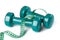 Green dumbell with measuring tape