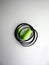 Green earplug noise protection for occupational safety on a white background. Close-up