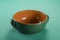 Green earthenware casserole typical of Tuscany