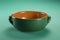 Green earthenware casserole typical of Tuscany