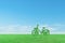 Green ecological bicycle on grass field and blue sky background.