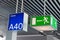 Green emergency exit sign, and blue gate sign