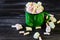 Green enameled mug with marshmallows