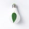 Green energy concept with a light bulb with green leaf on a white background