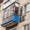 Green energy from solar panels on the balcony and wall in a multi-storey building gives free electricity to a separate apartment