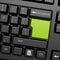 Green enter button in black keyboard