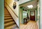 Green entryway of country house with hardwood floor and skylight.