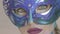 Green eyes look of the mysterious girl in venetian mask with winter art make up