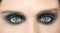 Green eyes woman, black makeup eye shadow