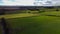 Green farm fields separated by shrubs, top view. Cattle pastures in the south of Ireland. Agricultural landscape, nature. Green