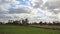 A green farm with trees and agriculture and clouds in Minya in Egypt