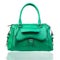 Green female handbag over white