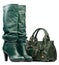 Green female high-heeled boots and leather bag