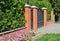 Green Fence with Entrance Door, Metal Gate and Trimmed Green Th