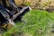 Green field being shoveled by bulldozer during earthmoving works