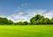 Green field and blue sky in spring.Great as a background