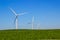 Green Field With Energy Producing Three Bladed Windmills