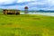 Green field and old belltower