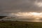 A green field overlooks the Seven Sisters