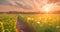 green field with the sun shining through the clouds, wind moving green grass, panoramic view