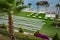 A green field with white chairs and tables. Place for wedding ceremonies.