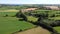 Green fields. Agricultural landscape on a summer day, drone video. The countryside of the Irish south