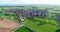 Green fields around a small town. Beautiful European landscape. Small European city aerial view. german village aerial