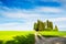 Green fields with cypress trees in Tuscany, Italy.