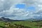 Green fields and distant mountains. Rural Wales near the seaside town of Criccieth.