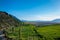 Green fields mountain and cloudy sky from acigol