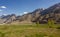 Green fields with mountains