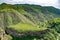 Green fields and mountains. Fascinating nature with unique mountains and rocks