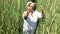 Green fields of nature. Harvest overview. The woman demonstrates the cultivated crop. Agriculture. New varieties. nature