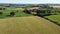 Green fields, top view. Agricultural landscape on a summer day, drone video. The countryside of the Irish south