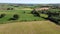Green fields, view. Agricultural landscape on a summer day, drone video. The countryside of the Irish south