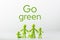 Green figures made of biodegradable plastic symbolic model of family with children Minimal ecology concept. Go Green.