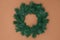 green fir thee Christmas wreath on beige background