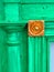 Green fireplace surround with gold medallion detail