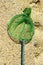 Green fishing net on the sand