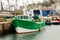 Green Fishing Trawler moored longside the Harbour Wall, Brixham, South Devon