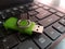 The green flashdisk on the keyboard