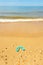 Green flip flops in Cuesta Maneli beach in the province of Huelva, Andalusia, Spain