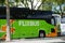 Green flixbus in rton of the train station in the streetn, flixbus is the famous intercity travel company