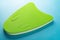 Green floating pad for kids to study swimming on blue