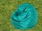 Green fluffy armchair on the grass