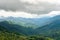 Green forest on mountain range landscape on haze day before raining